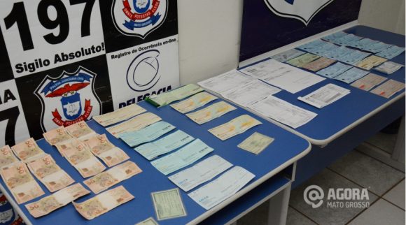 Dinheiro e cheques apreendidos com os suspeitos de estelionato. Foto:Varlei Cordova/AGORAMT